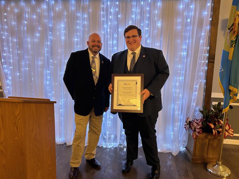 DLLG president and Clayton Mayor Nick Smith, left, presents the National League of Cities Centennial Under 40 Impact Award to Clayton Vice Mayor Ryan Paisley. The Impact Award celebrates elected officials under 40 from NLC member cities, towns and villages.